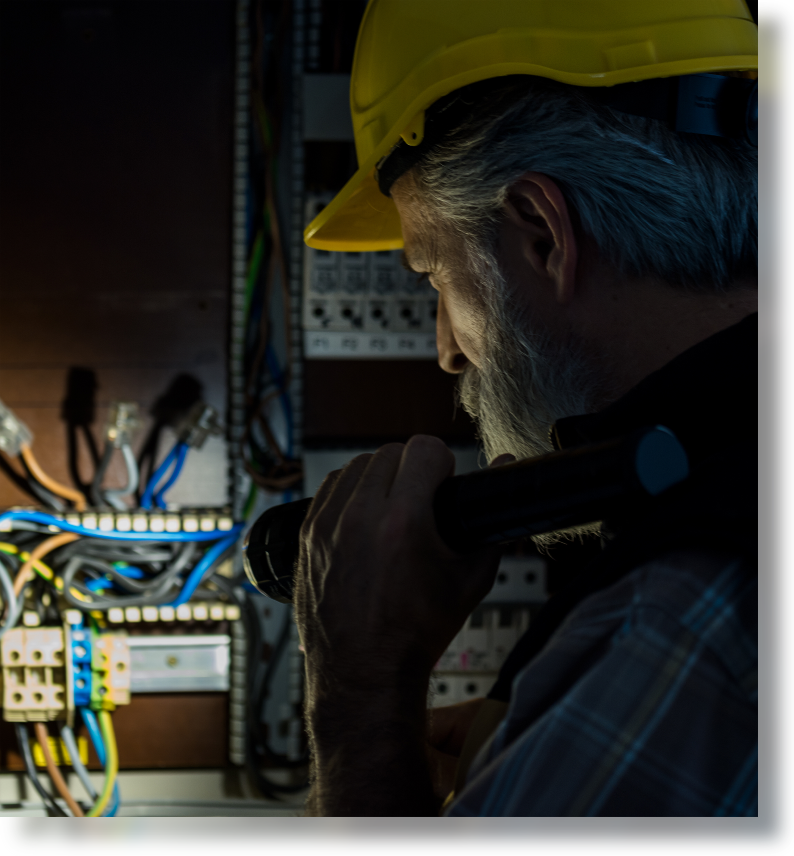 Photo of a man checking the electrical outlet